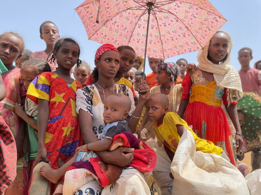 Ethiopia: Women and children wait in line at WFP food distribution point in the Asegede district of Tigray. Photo: WFP/Claire Nevill